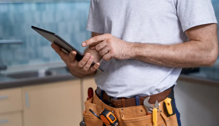 Downloaded Find Similar File #: 388251155 Young builder working on tablet